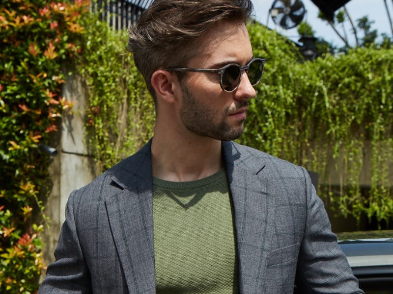 Man wearing a grey windowpane check suit.
