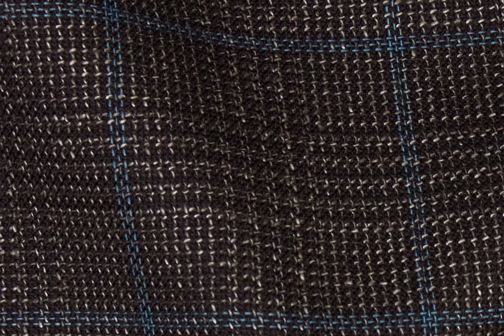 Athos OP 2401 is a wool, cotton and linen blend fabric in chocolate brown with a vivid blue windowpane check.