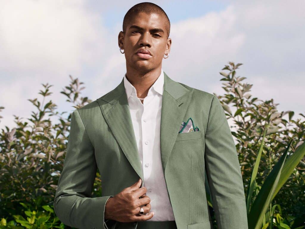 A model wears a Solaro suit made with OP2527 Langston with a formal white shirt.