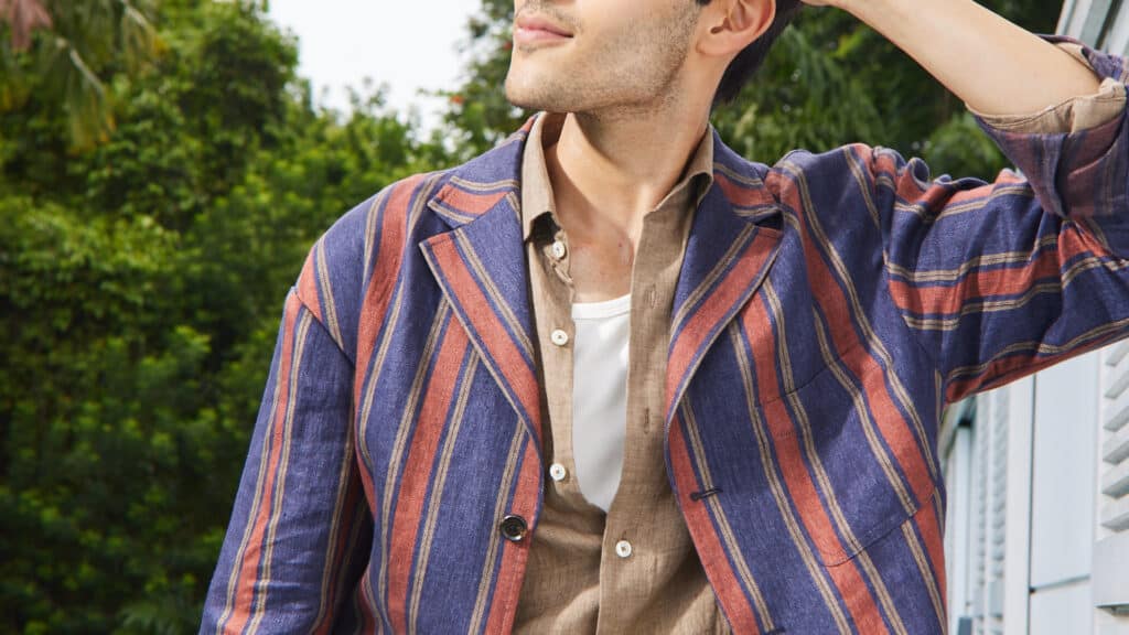 Officine Paladino’s OP2622 Portofino is a lighter-weight linen fabric with a striped pattern in purple, red, and gold