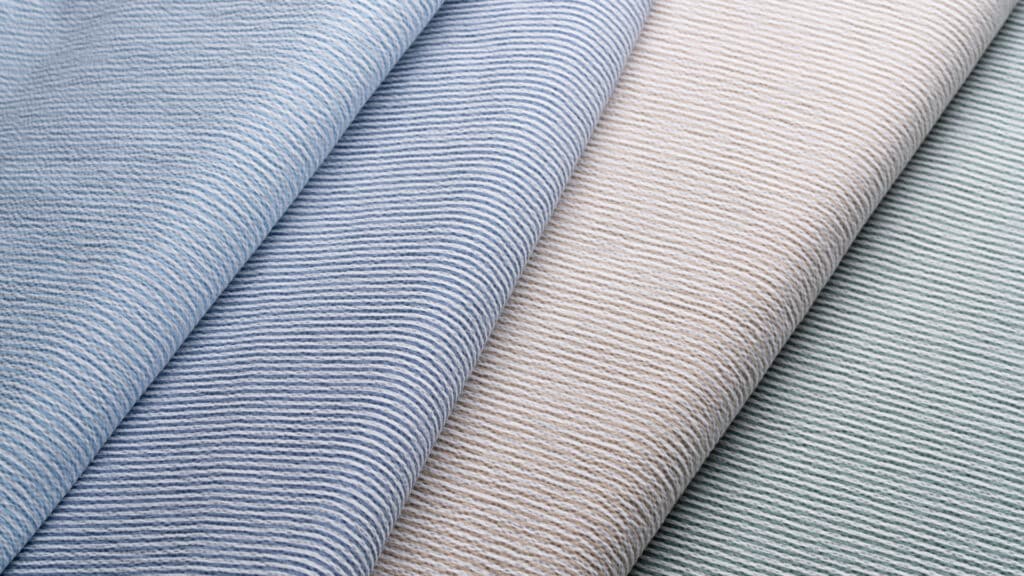 (Left to right) Shown here are Officine Paladino’s seersucker fabrics OP1971 Baby Blue, OP1972 Moroccan Blue, OP1974 Biscuit, and OP1975 Chartreuse.