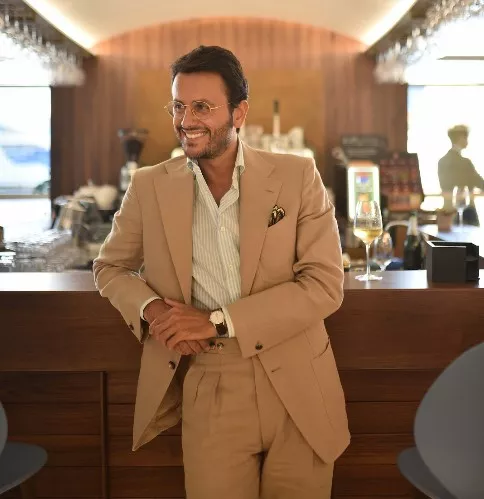 Man wearing beige suit
