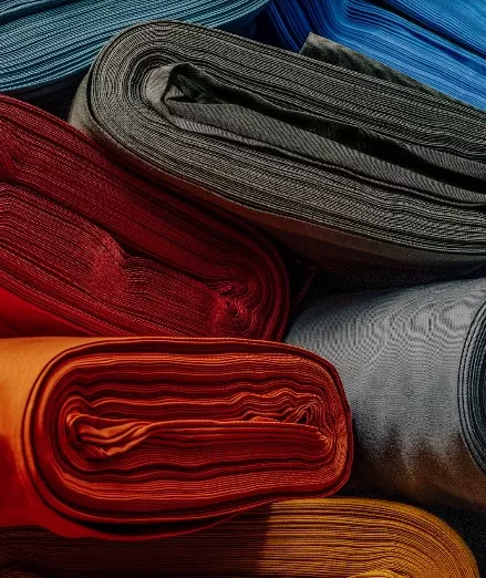 Rolls of high quality cotton fabrics used for suiting in different colours