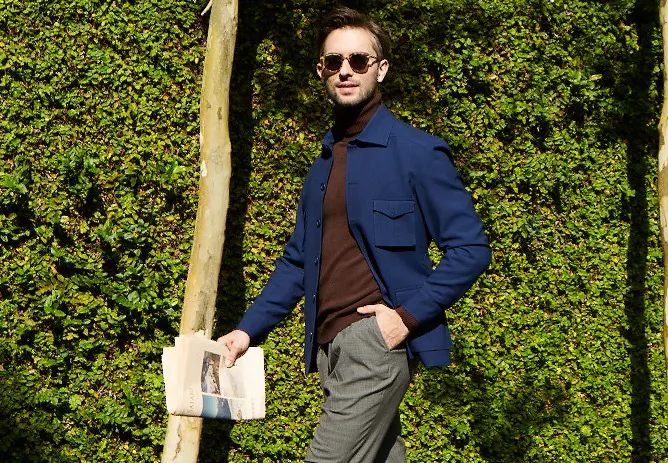 Man wearing a lightweight wool unlined jacket.